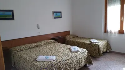 Letto o letti in una camera di Albergo Sonia
