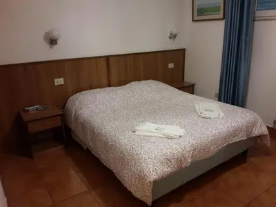 Letto o letti in una camera di Albergo Sonia