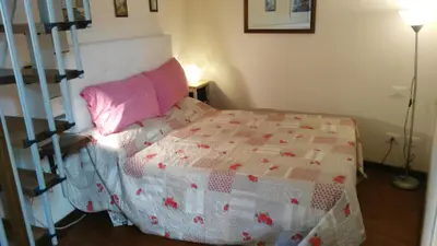 Letto o letti in una camera di Sunflower Firenze Centro