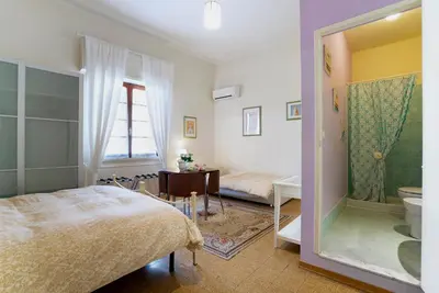 Letto o letti in una camera di 1900 Artevita B&B