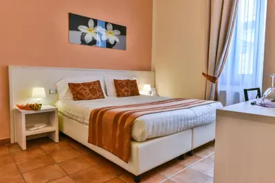 Letto o letti in una camera di Hotel Bella Firenze