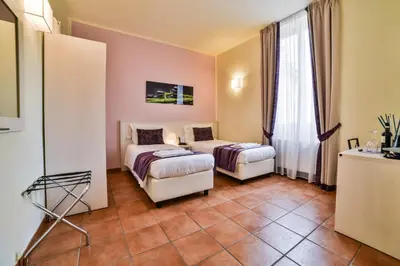 Letto o letti in una camera di Hotel Bella Firenze
