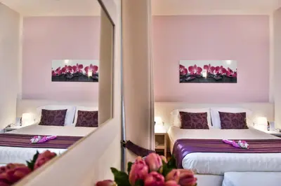 Letto o letti in una camera di Hotel Bella Firenze