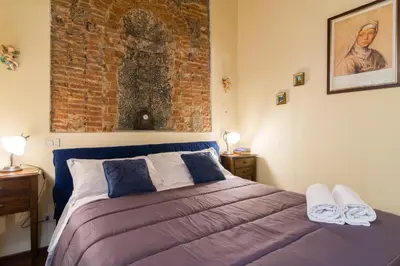 Letto o letti in una camera di GuestHost - Florence Ariento Romantic Apartment