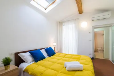 Letto o letti in una camera di GuestHost - Della Scala Modern Apartment