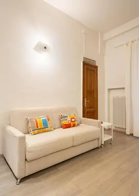 Area soggiorno di Keys of Italy - Pergola 19 - 1 Bdr Flat with inner courtyard