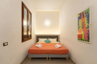 Letto o letti in una camera di Keys of Italy - Pergola 19 - 1 Bdr Flat with inner courtyard