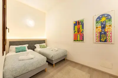 Letto o letti in una camera di Keys of Italy - Pergola 19 - 1 Bdr Flat with inner courtyard