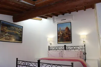 Letto o letti in una camera di Max Studios Florence