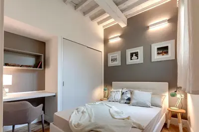 Letto o letti in una camera di Il Moro Apartment by Mamo Florence
