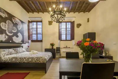 Letto o letti in una camera di Capponi Suite