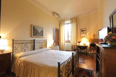 Letto o letti in una camera di Villa Il Colle B&B