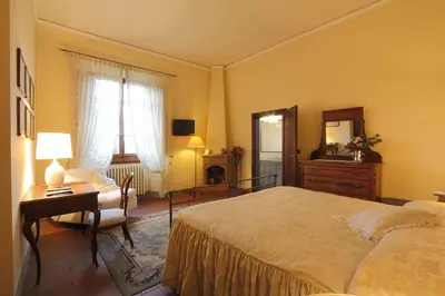 Letto o letti in una camera di Villa Il Colle B&B