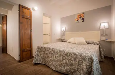 Letto o letti in una camera di Corte Novella Apartment
