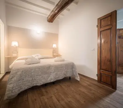 Letto o letti in una camera di Corte Novella Apartment