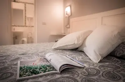 Letto o letti in una camera di Corte Novella Apartment