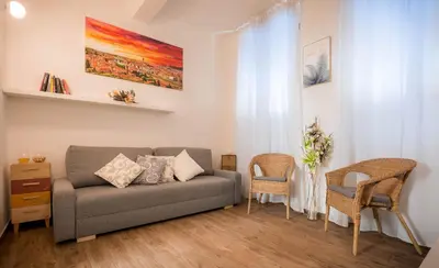 Area soggiorno di Corte Novella Apartment