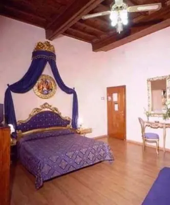 Letto o letti in una camera di Hotel Abaco