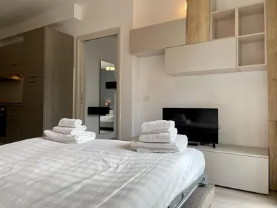 Letto o letti in una camera di Borgo Guelfo VIII