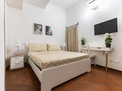 Letto o letti in una camera di San Lorenzo affittacamere