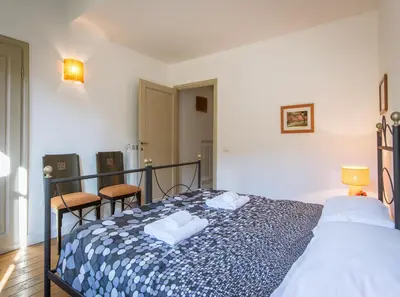Letto o letti in una camera di Uffizi Gallery Rooftop Apartment by Mamo Florence