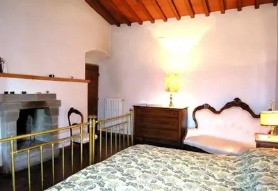 Letto o letti in una camera di Casale Le Torri