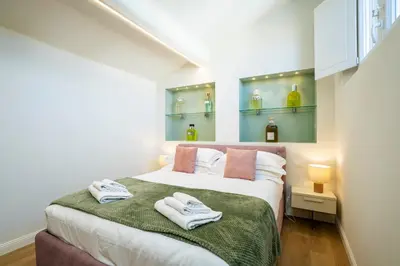 Letto o letti in una camera di Cherubini Palace Thematic Apartment