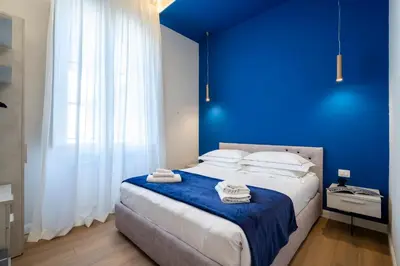 Letto o letti in una camera di Cherubini Palace Thematic Apartment