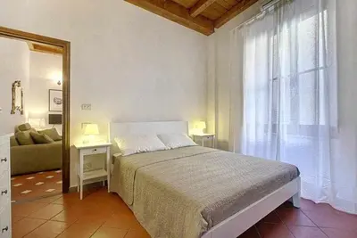 Letto o letti in una camera di Panzani Rustico Vicino Santa Maria Novella
