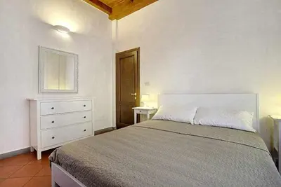 Letto o letti in una camera di Panzani Rustico Vicino Santa Maria Novella