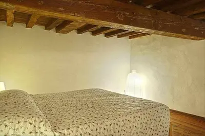 Letto o letti in una camera di Panzani Rustico Vicino Santa Maria Novella