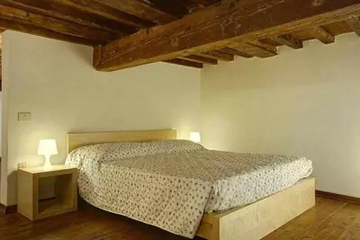 Letto o letti in una camera di Panzani Rustico Vicino Santa Maria Novella