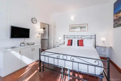 Letto o letti in una camera di Wine Apartments Florence Prugnolo