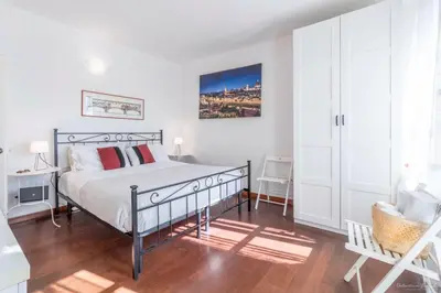 Letto o letti in una camera di Wine Apartments Florence Prugnolo