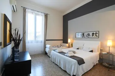 Letto o letti in una camera di B&B In Centro