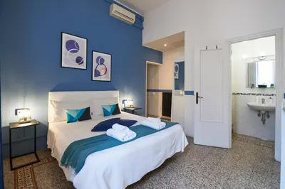 Letto o letti in una camera di B&B In Centro