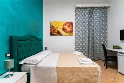 Letto o letti in una camera di B&B La Cittadella