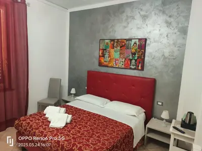 Letto o letti in una camera di B&B La Cittadella