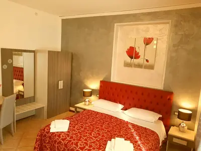 Letto o letti in una camera di B&B La Cittadella