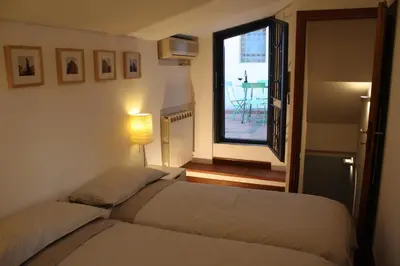 Letto o letti in una camera di S.Zanobi courtyard house w/ terrace
