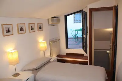 Letto o letti in una camera di S.Zanobi courtyard house w/ terrace