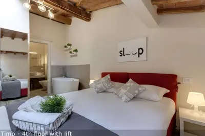 Letto o letti in una camera di Vertical Garden Apartments by Mamo Florence