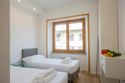 Letto o letti in una camera di Alinari Apartment