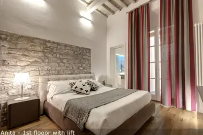 Letto o letti in una camera di Belle Donne Apartments by Mamo Florence