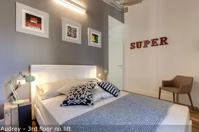 Letto o letti in una camera di Belle Donne Apartments by Mamo Florence