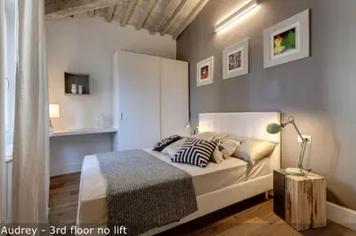 Letto o letti in una camera di Belle Donne Apartments by Mamo Florence