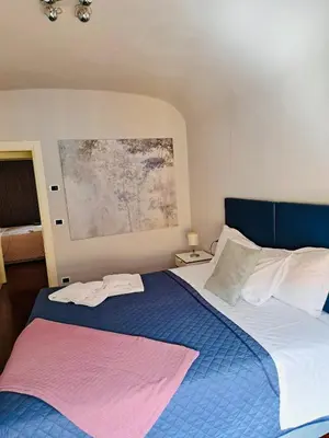 Letto o letti in una camera di Le Dimore di Casa Mattei n°9