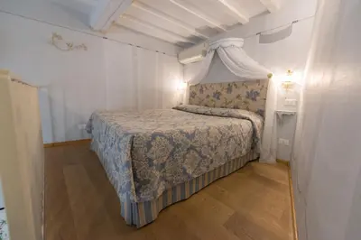 Letto o letti in una camera di Corte Dei Neri