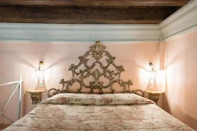 Letto o letti in una camera di Corte Dei Neri