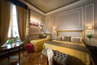 Letto o letti in una camera di Boutique B&B Torre de' Conti